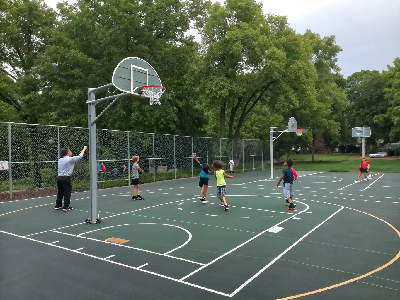 A vibrant image of young children participating in a basketball training session, focusing on fundamental skills with enthusiastic coaches guiding them at OULLINS SAINTE FOY BASKET.